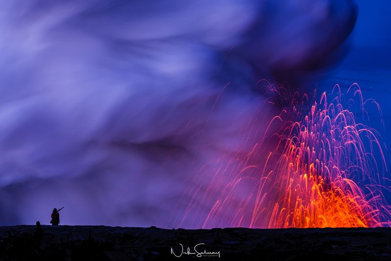 In this beautiful image of Hawaiian lava, lava erupts out of the ground high into the sky. Shop this print & a variety of lava photography from Hawaii ​for sale