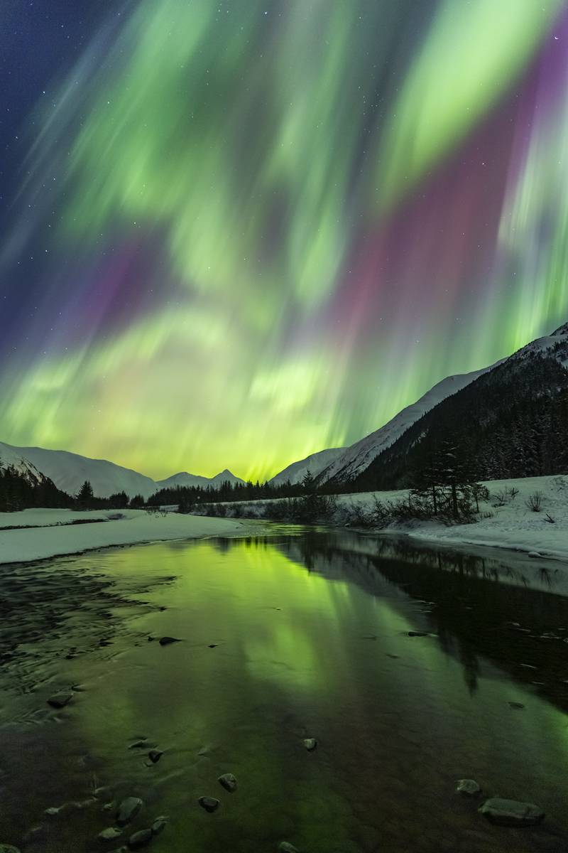 Northern Light put on show for hours reflecting in the still water off a small river south of Anchorage.